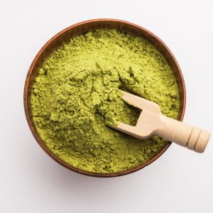 Herbal henna or Mehandi powder in a bowl forming heap, Used for Tattoo or Hair Dye in India